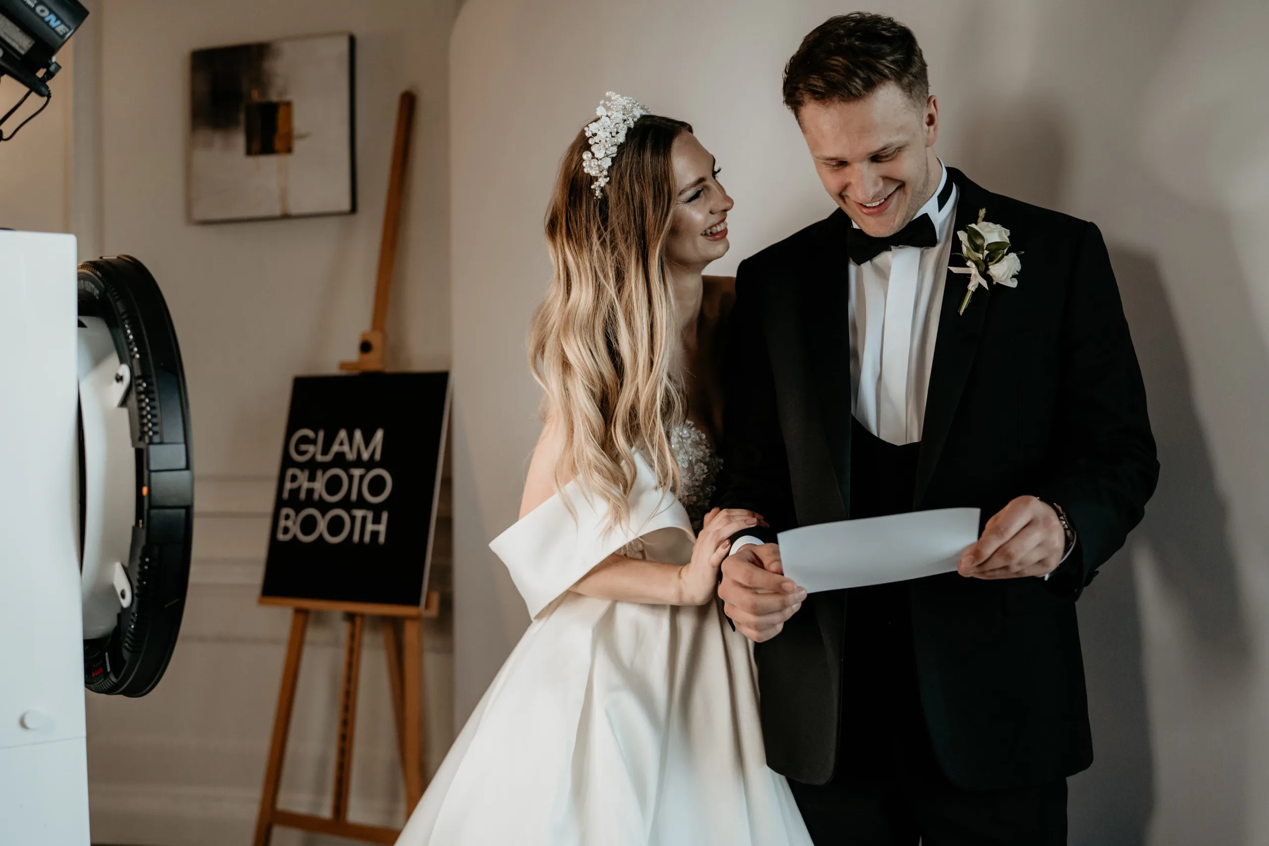 Bride and Groom look at their print from the Studio Photo Booth at their wedding