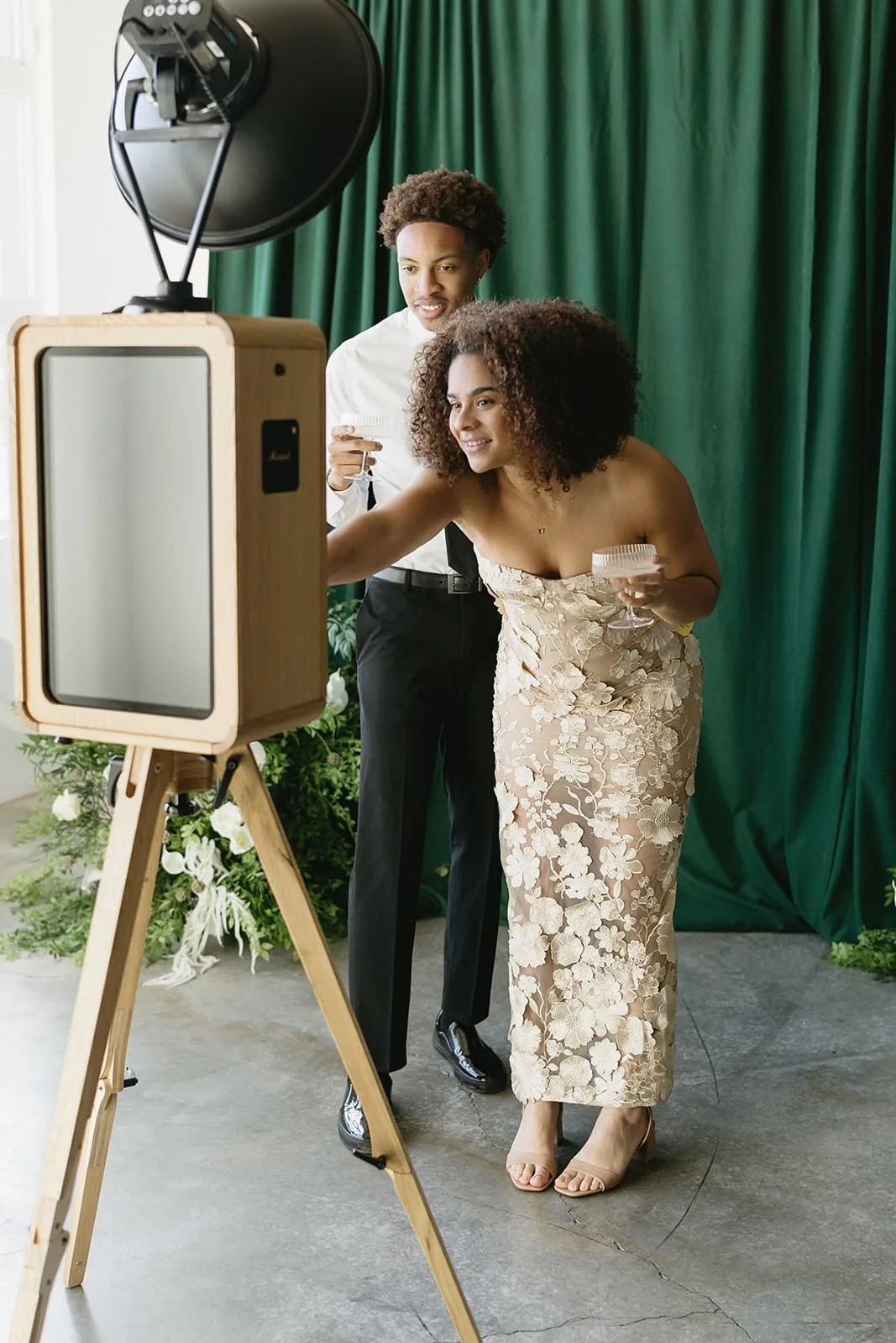 A could stand in front of the Studio Photo Booth once their photo has been captured