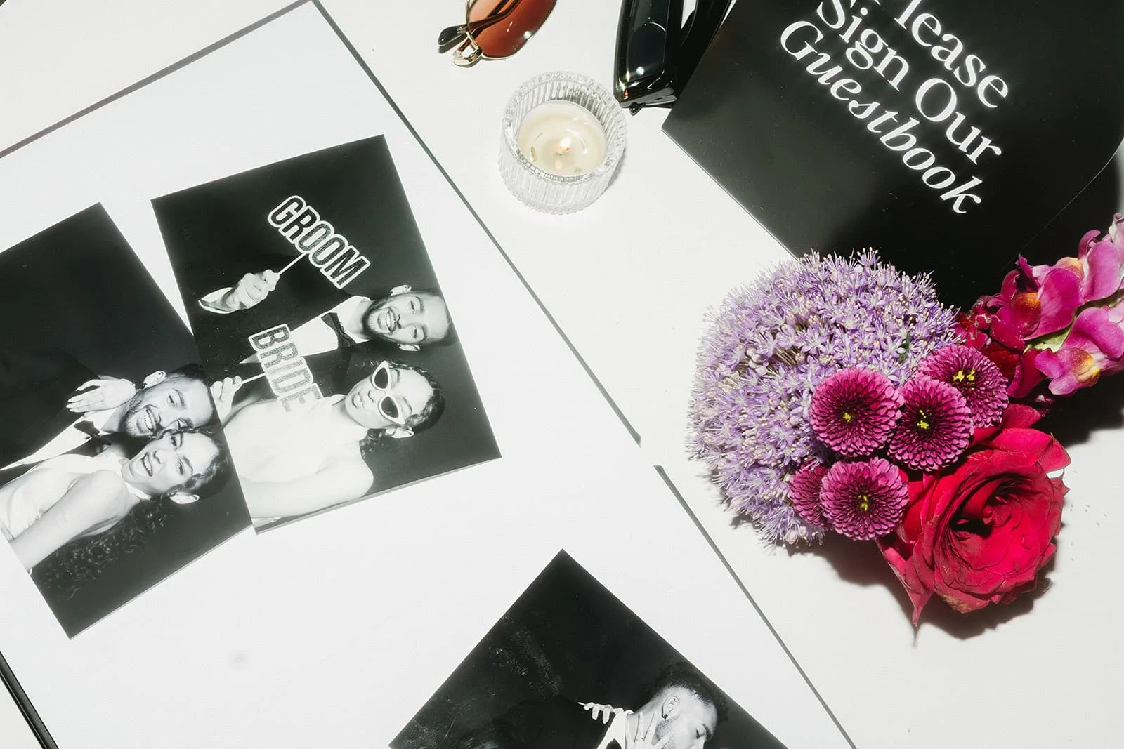 Flatlay of Studio Photo Booth prints in the guest book